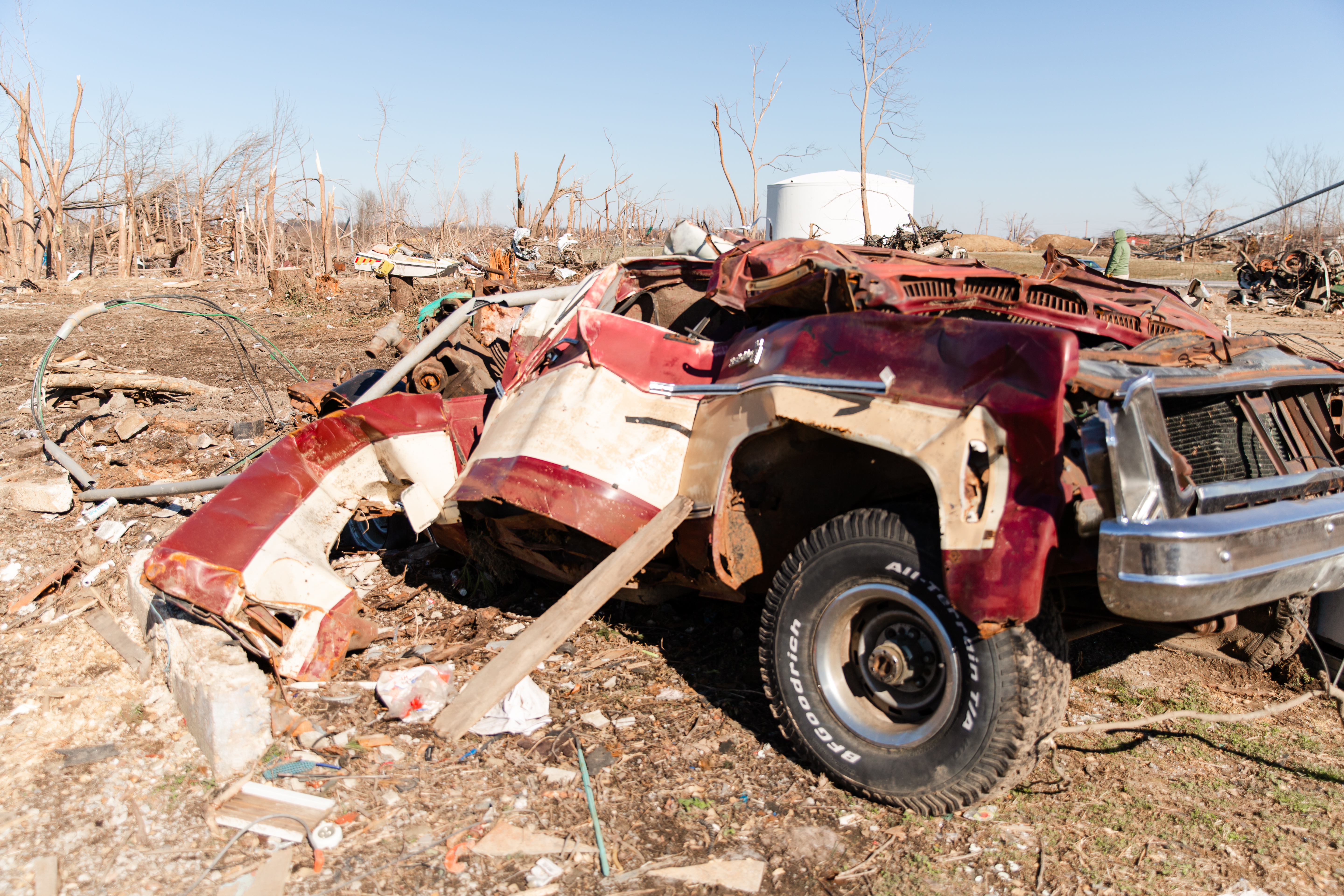 image of a car completely damaged by the tornado