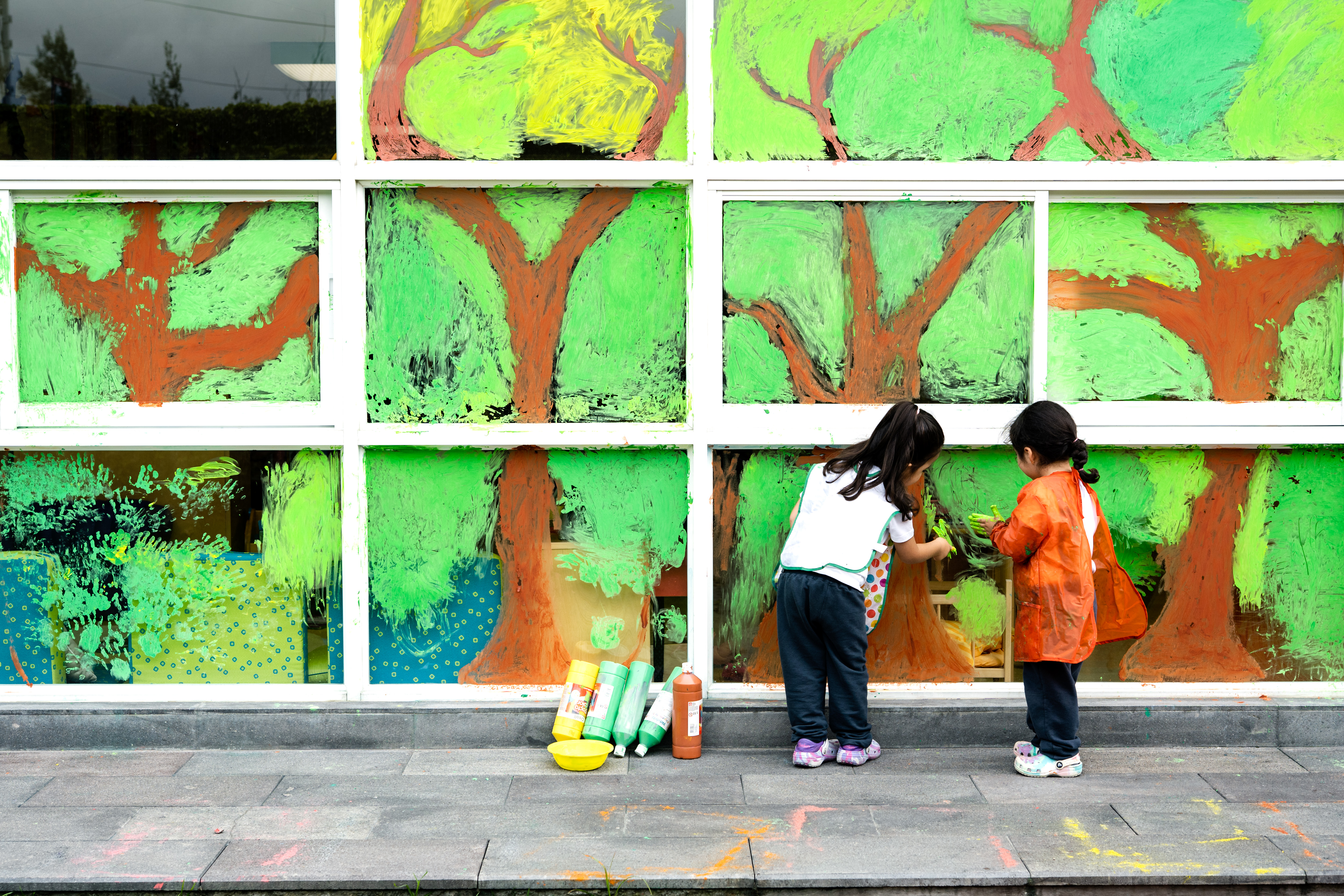photo of two little girls doing hand painting
