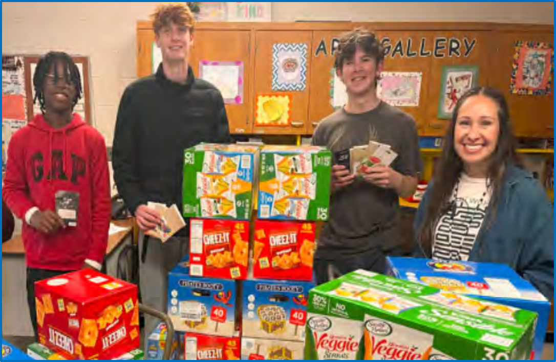 Champlin Park High School Leos displaying results of their food drive.